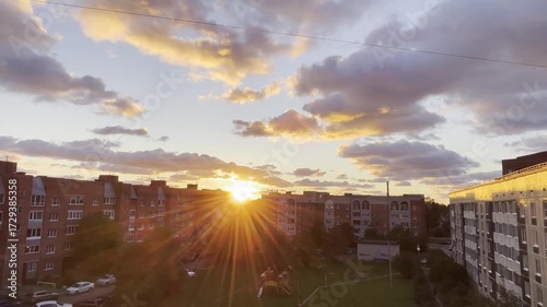 Golden sunset shining over urban residential buildings