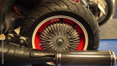 Custom scooter rear wheel and carbon exhaust