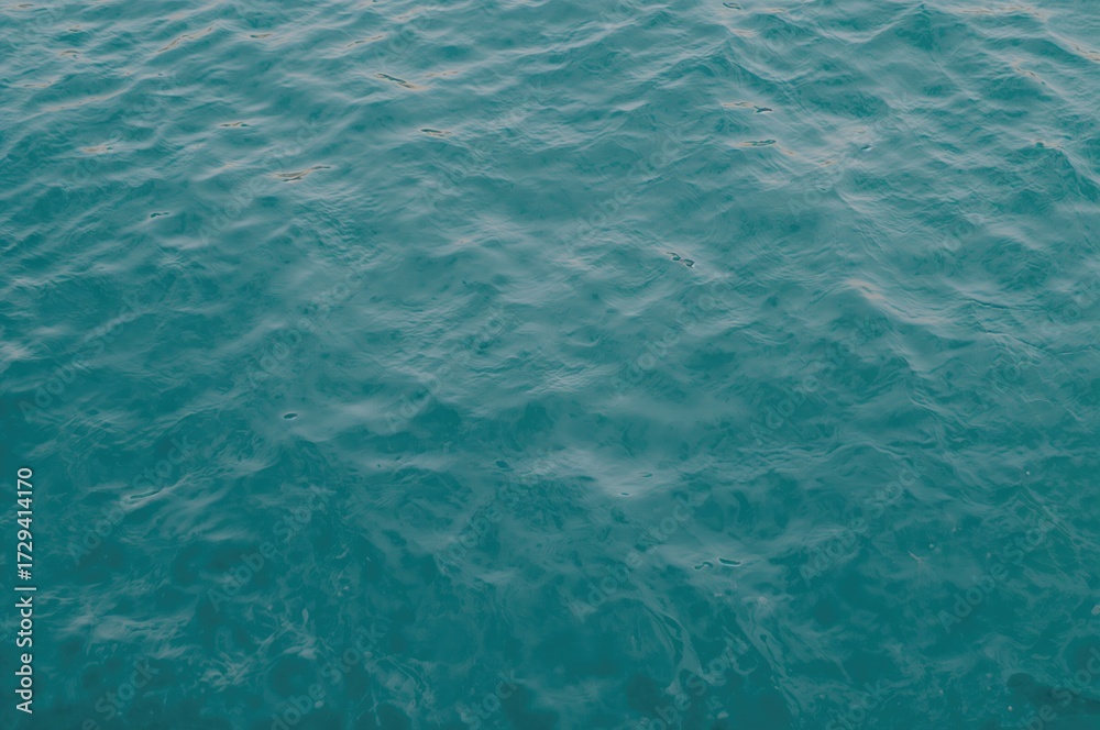 Fototapeta premium Calm ripple pattern on a serene aqua surface, textured background image
