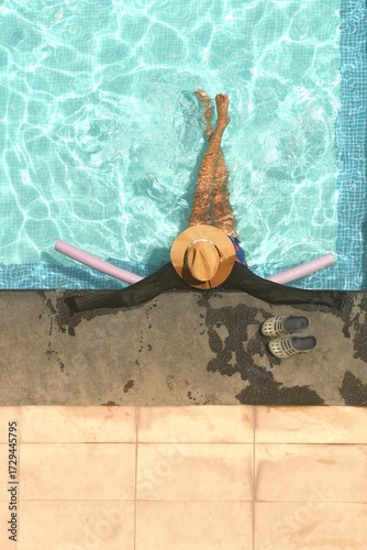 Relaxing at the resort swimming pool