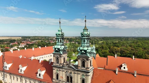 Wallpaper Mural Aerial drone view of Cistercian Abbey in Lubiąż, Lower Silesia, Poland, surrounded by lush green forests, river, and scenic countryside landscape, historic monastery and cultural heritage site Torontodigital.ca