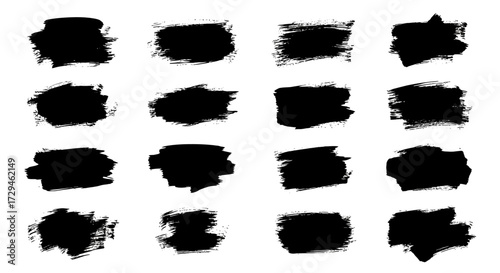 Collection of sixteen abstract black brush stroke textures with rough edges and opaque fill isolated on a white background conveying a raw artistic aesthetic