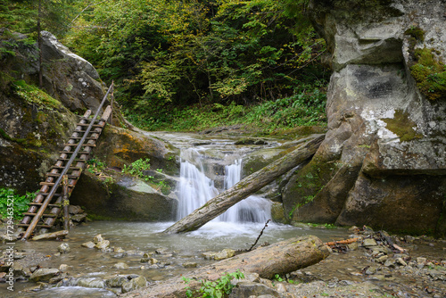 Waterfall Vorota, Bukovynski cascades in Velykyi Roztoky in the autumn forest. Carpathian Mountains, Chernivtsi oblast, Ukraine.