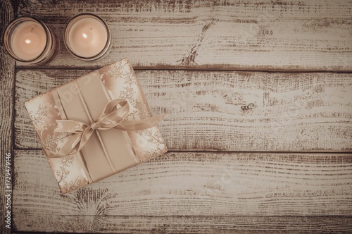 Candle-lit gift box placed ...