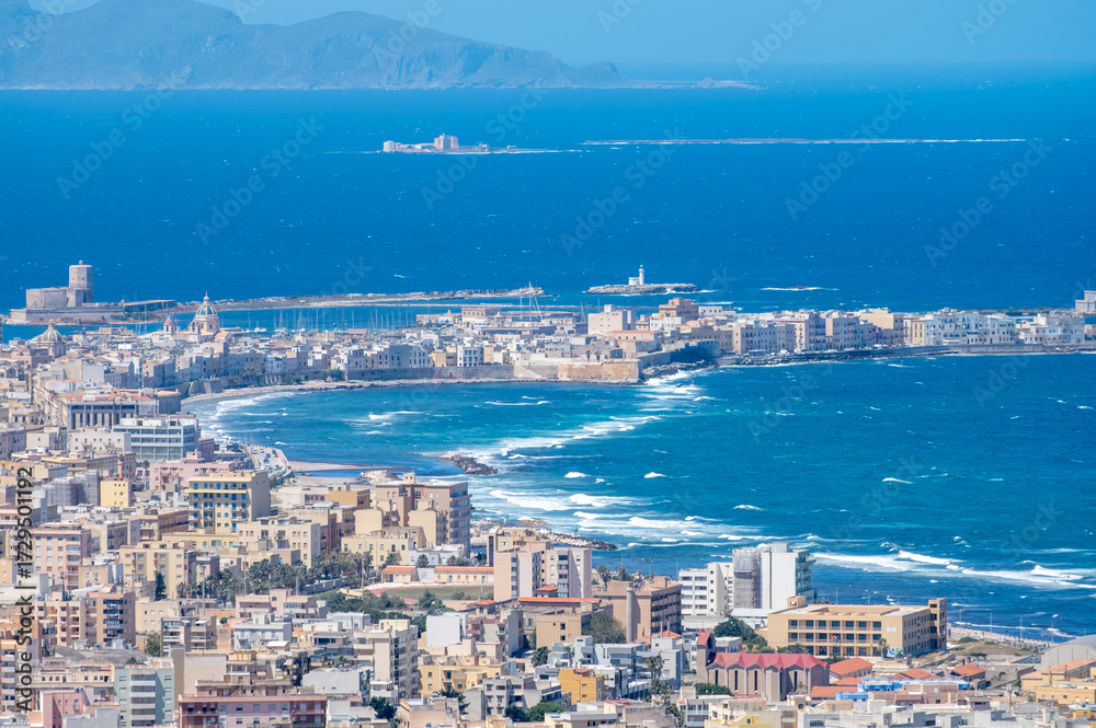 Fototapeta premium View from heights of Erice to scenic coastal roads, Trapani’s salt pans and olive groves, panoramic view on Trapany and Mediterranean sea, travel destination in Italy