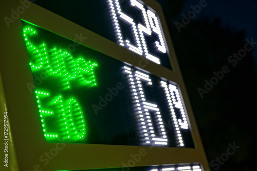 Fuel price board at station showing Super 161.9 green