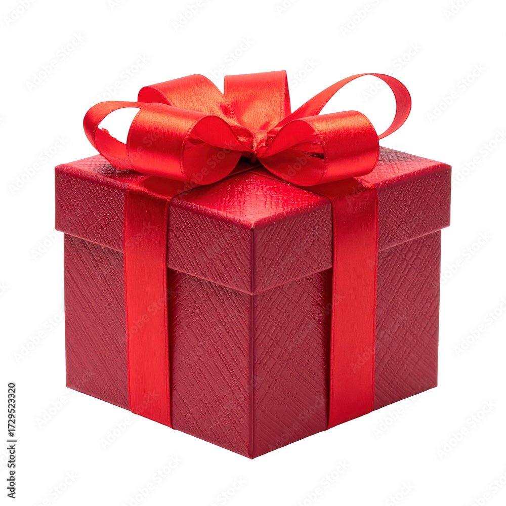 Obraz premium Elegant red gift box with a satin ribbon and bow on a stark black background, emphasizing the details and festive ambiance of the present.