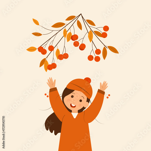 A smiling girl with long hair and raised hands on a light background. Above her is a rowan branch with berries and autumn leaves.