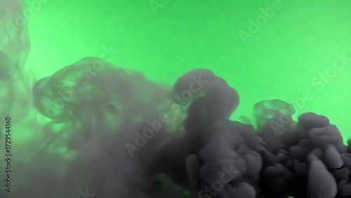 Dense Black Smoke Cloud Over Bright Green Background