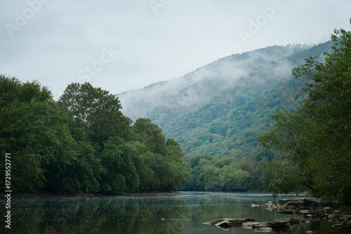 Misty clouds hover over the fall foliage along the Juniata River in Southern Pennsylvania