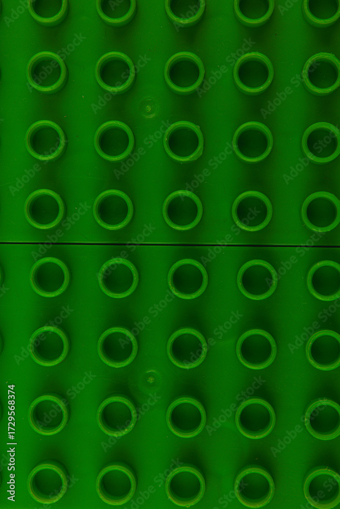 Fototapeta premium Bright green building base ideal for creative construction projects