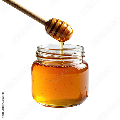 Honey dripping from a wooden dipper into a glass jar (2)
