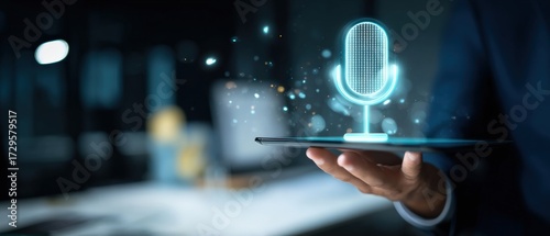Hand holding a digital tablet with a glowing AI voice assistant microphone icon, symbolizing smart technology and interaction
