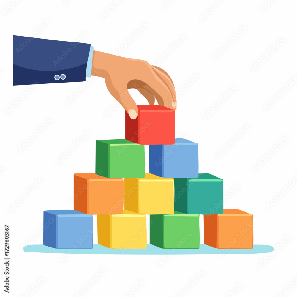 Fototapeta premium Hand Placing Colorful Building Block on Top of a Stacked Pyramid Against White Background
