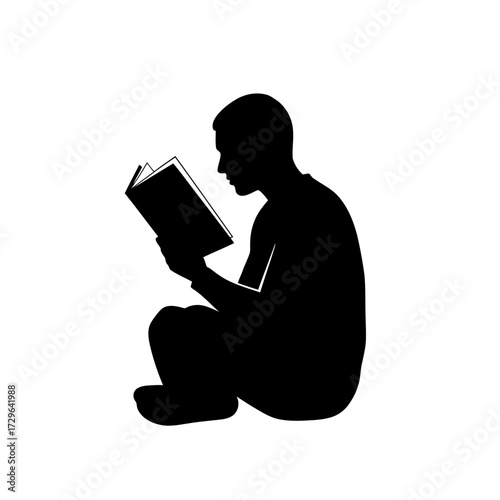 Silhouette of a person reading a book