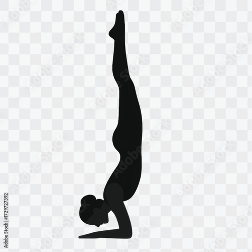 Silhouette of a Woman Practicing Yoga Headstand Pose.