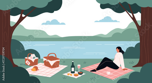 Enjoying a serene lakeside picnic surrounded by nature and tranquility.