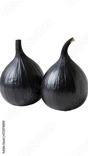 Two dark, glossy figs, close-up