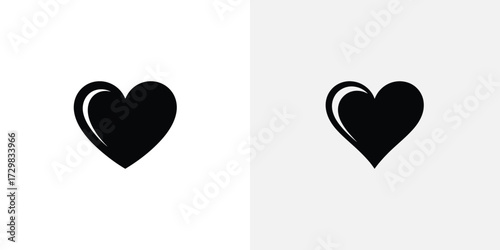 Two Black Heart Icons Smooth and Pointed Love Symbol Variations on White and Light Gray