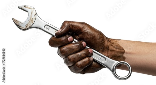 A mechanics hand gripping a wrench with grease covering the hand and arm