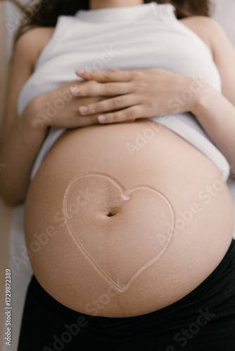 Wallpaper Mural Doctor applies ultrasound gel in smiley shape on pregnant belly before scan in gynecology clinic Torontodigital.ca