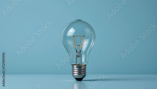 Central Lit Filament Bulb with Blue Monochrome Background
