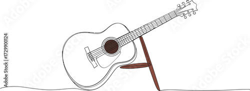 Acoustic guitar silhouette with delicate line art drawing standing on a simple wooden stand against a softly lit background evoking creativity and musical inspiration