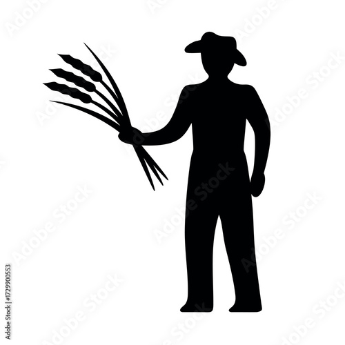 Silhouette of a farmer wearing a hat and overalls holding a bundle of wheat stalks