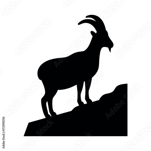 Silhouette of a majestic ibex with curved horns standing on a rocky outcrop against a white background