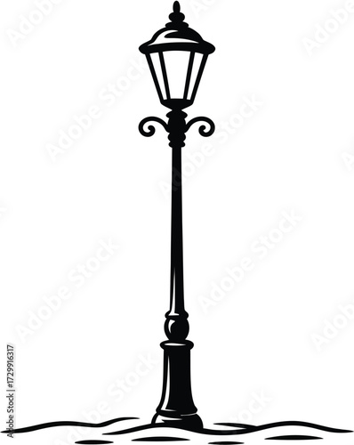 Classic ornate street lamp post with decorative details illuminated in vintage style