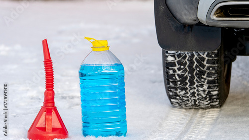 Habitat for car windshield on snow near the wheel