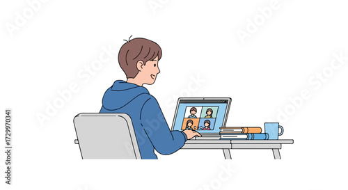 Young boy engaging in an online video conference call on his laptop from home illustrating remote learning, staying connected and communication with