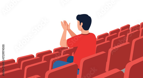Audience member applauding in a theater or auditorium, showcasing appreciation and supporting arts or presentations at an event