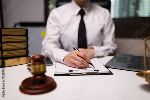 Female lawyer in office, Corporate lawyer at workspace, Attorney with legal books and gavel,
