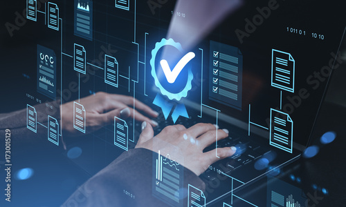 Digital certification icon and virtual documents over hands typing on laptop representing secure data approval and quality assurance concept.