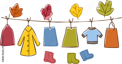 a line of colorful clothing hanging on a clothesline with leaves