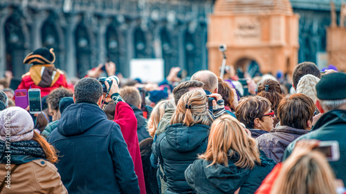 Venice, Italy - February 8, 2015: Crowd along St Mark Square during the carnival parade