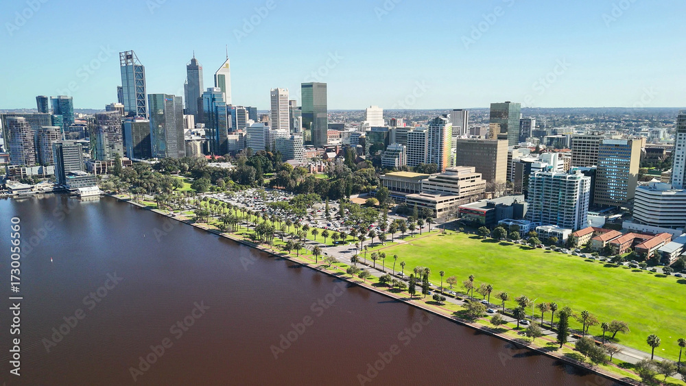 Fototapeta premium Drone shot of Perth cityscape from Swan River showing skyscrapers under bright sunlight