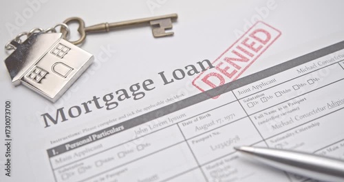 Mortgage loan form marked DENIED in red stamp, representing rejection of housing credit, financial failure, and banking loan denial.