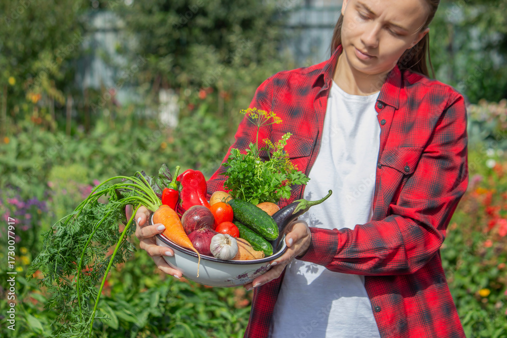 Fototapeta premium Girl Holding a Bowl of Fresh Organic Vegetables