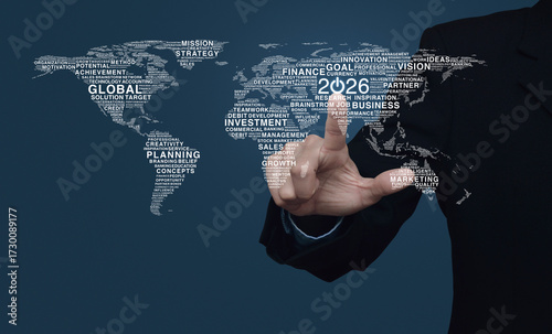 Fototapeta Naklejka Na Ścianę i Meble -  Businessman pressing 2026 start up business icon with global business words world map over blue wall, Happy new year 2026 global business start up concept, Elements of this image furnished by NASA