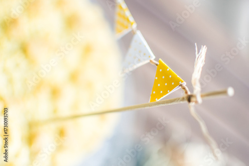 decorative white and yellow paper flags