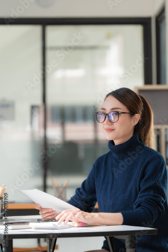 Businesswoman calculating budget numbers, Invoices, and a financial adviser working.