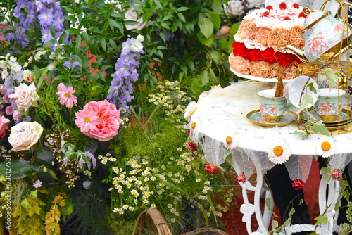Tableau sur toile Afternoon tea inspired by the elegance of formal British countryside gardens whe