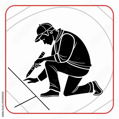 Silhouette of a surveyor marking a point