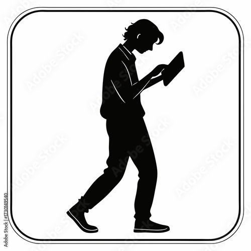 Silhouette of a young man walking and looking down at a tablet device held in his hands isolated on a white background within a rounded square frame