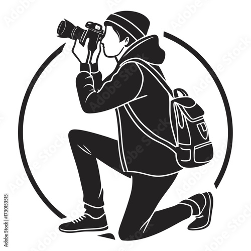 Photographer kneeling and taking a picture with camera