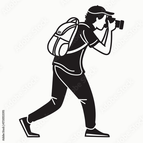 A black and white silhouette illustration of a person wearing a backpack and a baseball cap actively taking a photograph with a camera held up to their face while walking forward