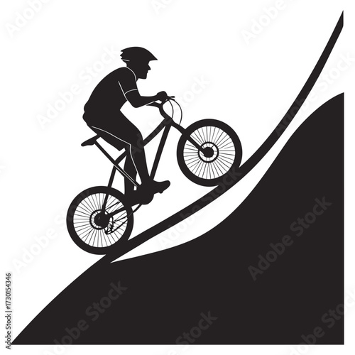 Silhouette of a mountain biker riding downhill on a steep slope