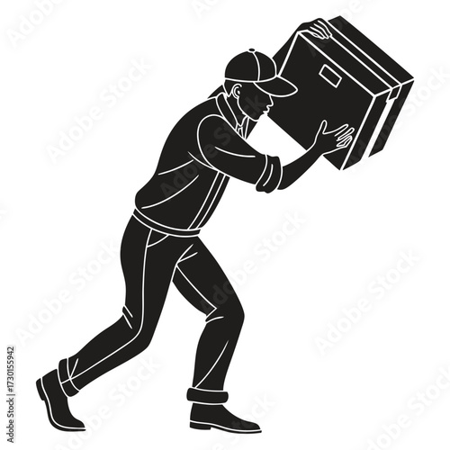 A delivery person wearing a cap and casual clothes is carefully carrying a large cardboard box with both hands moving forward with effort and focus